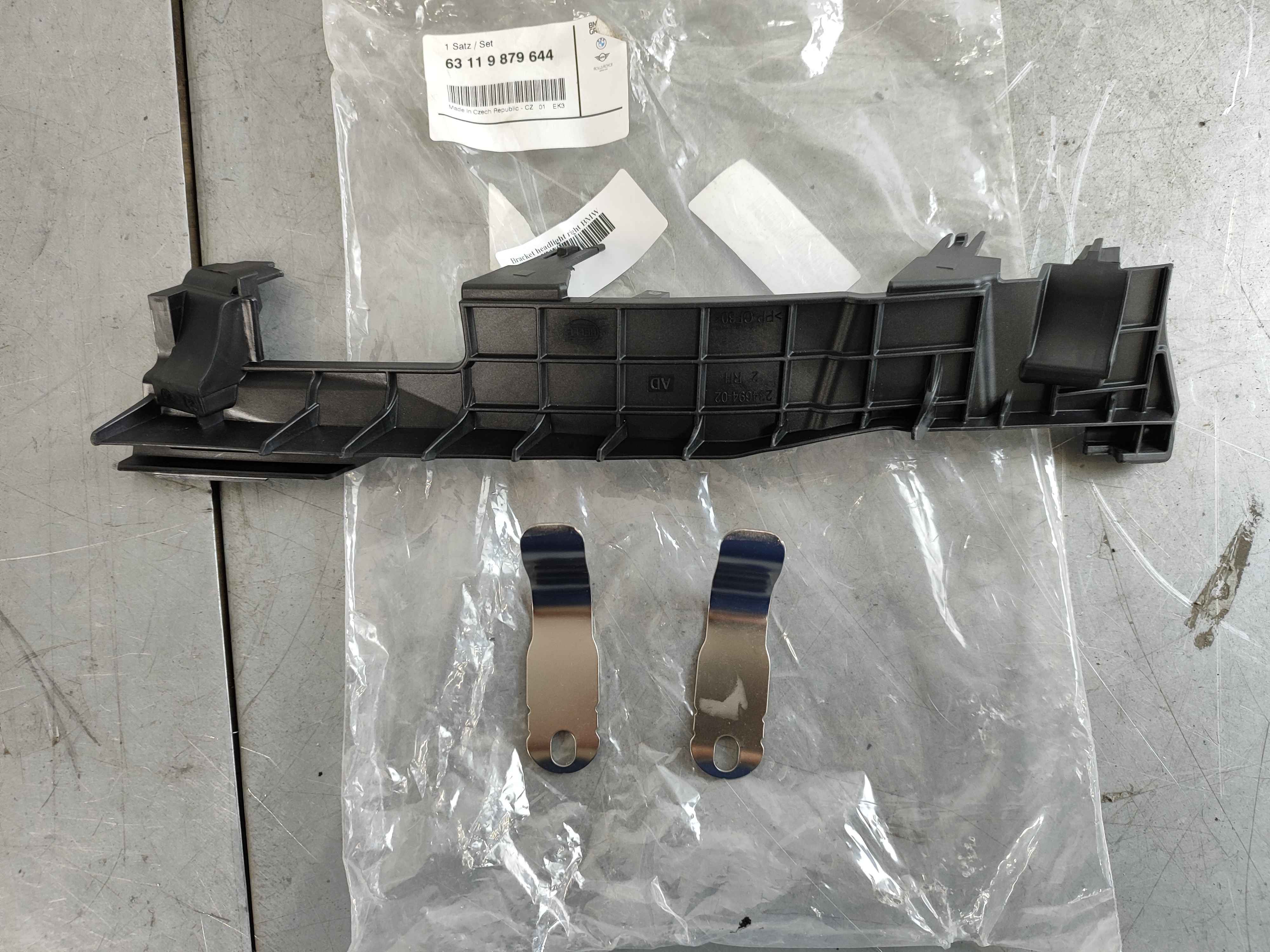 Bracket headlight right BMW