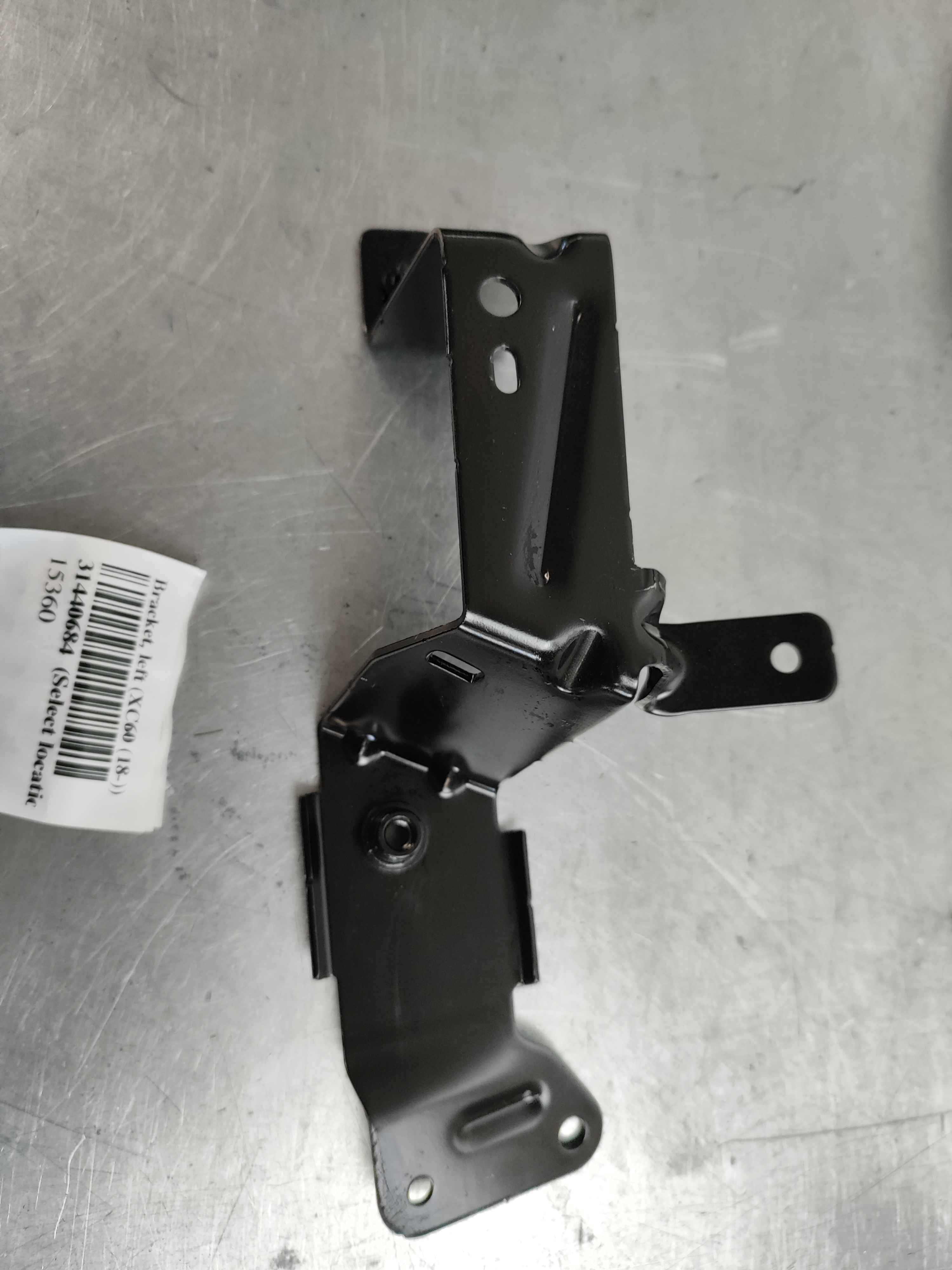 Bracket, left (XC60 (18-))