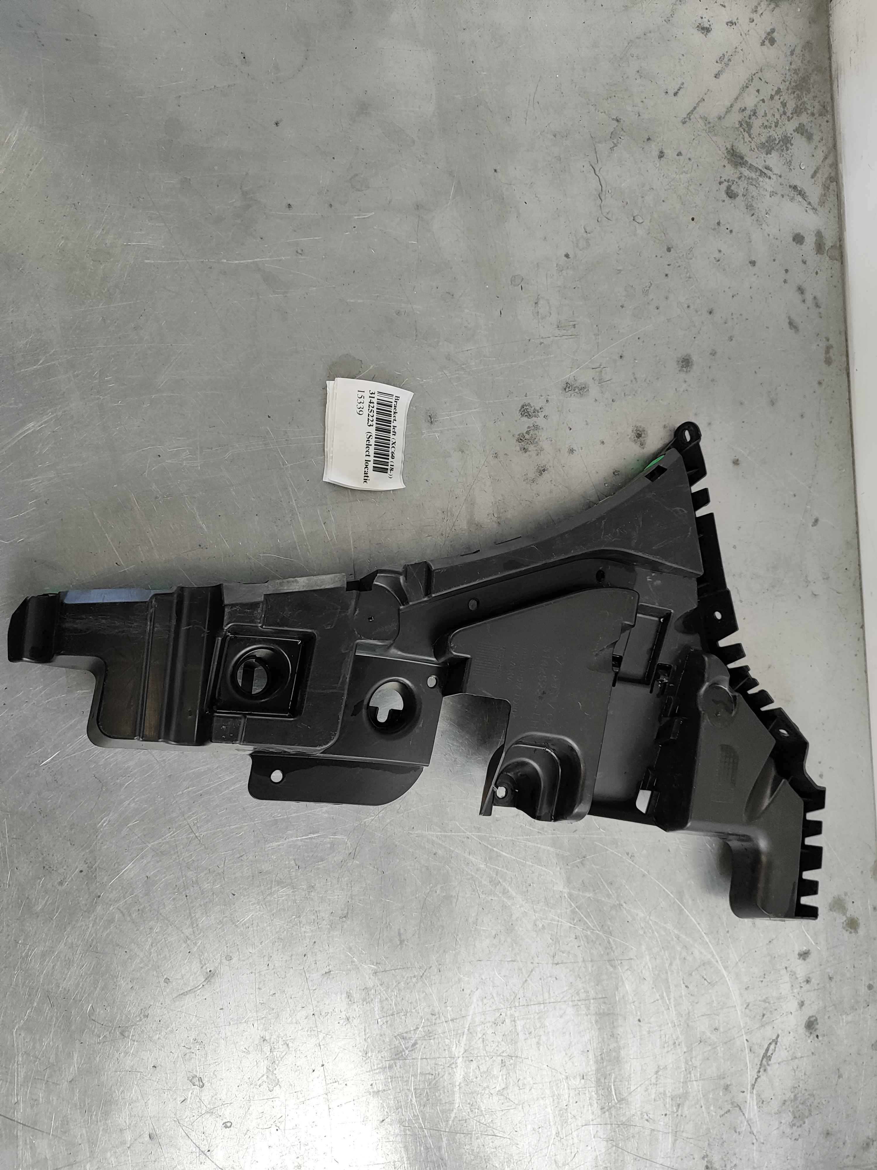 Bracket, left (XC60 (18-))
