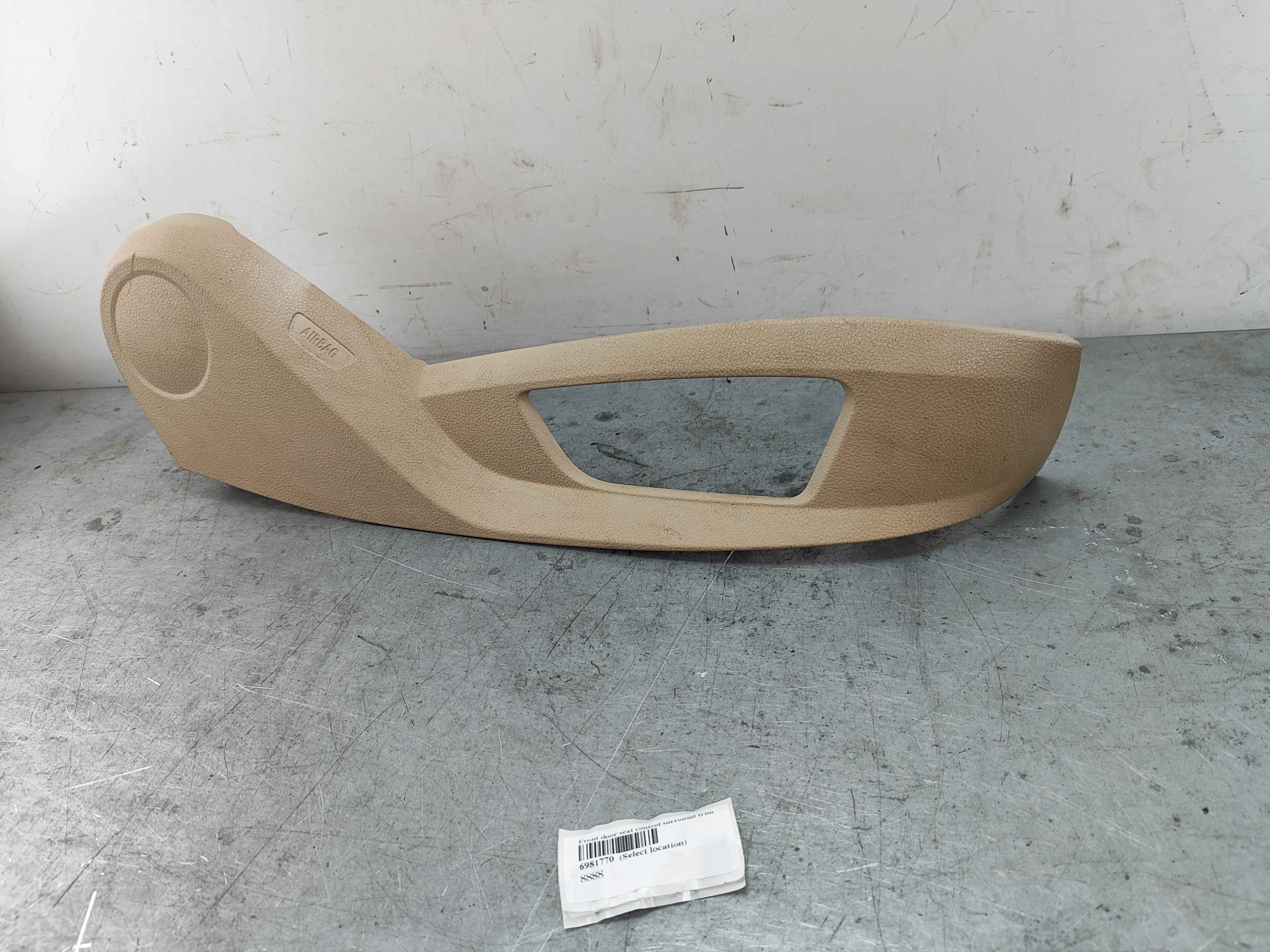 Front door seat control surround trim