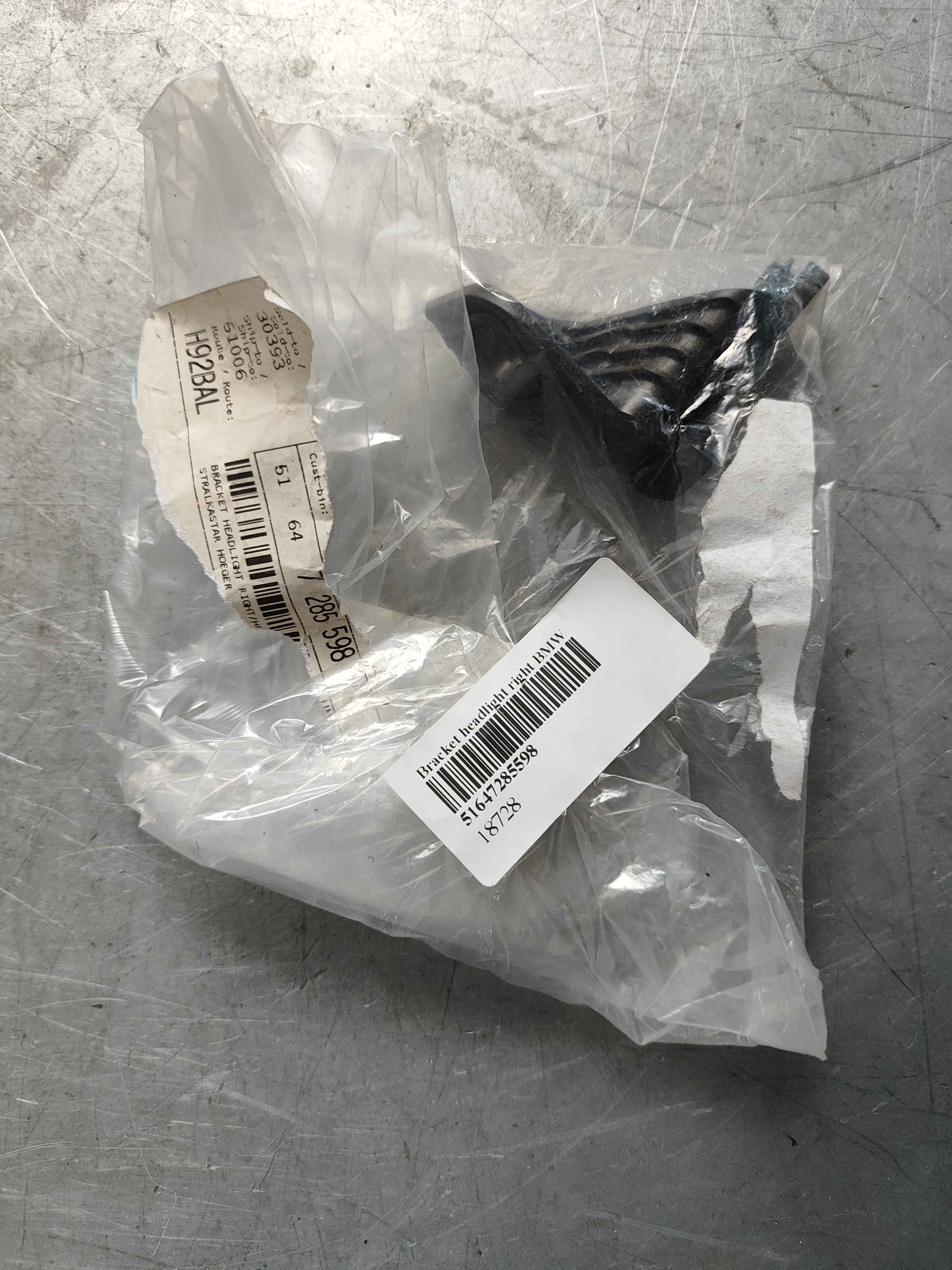 Bracket headlight right BMW