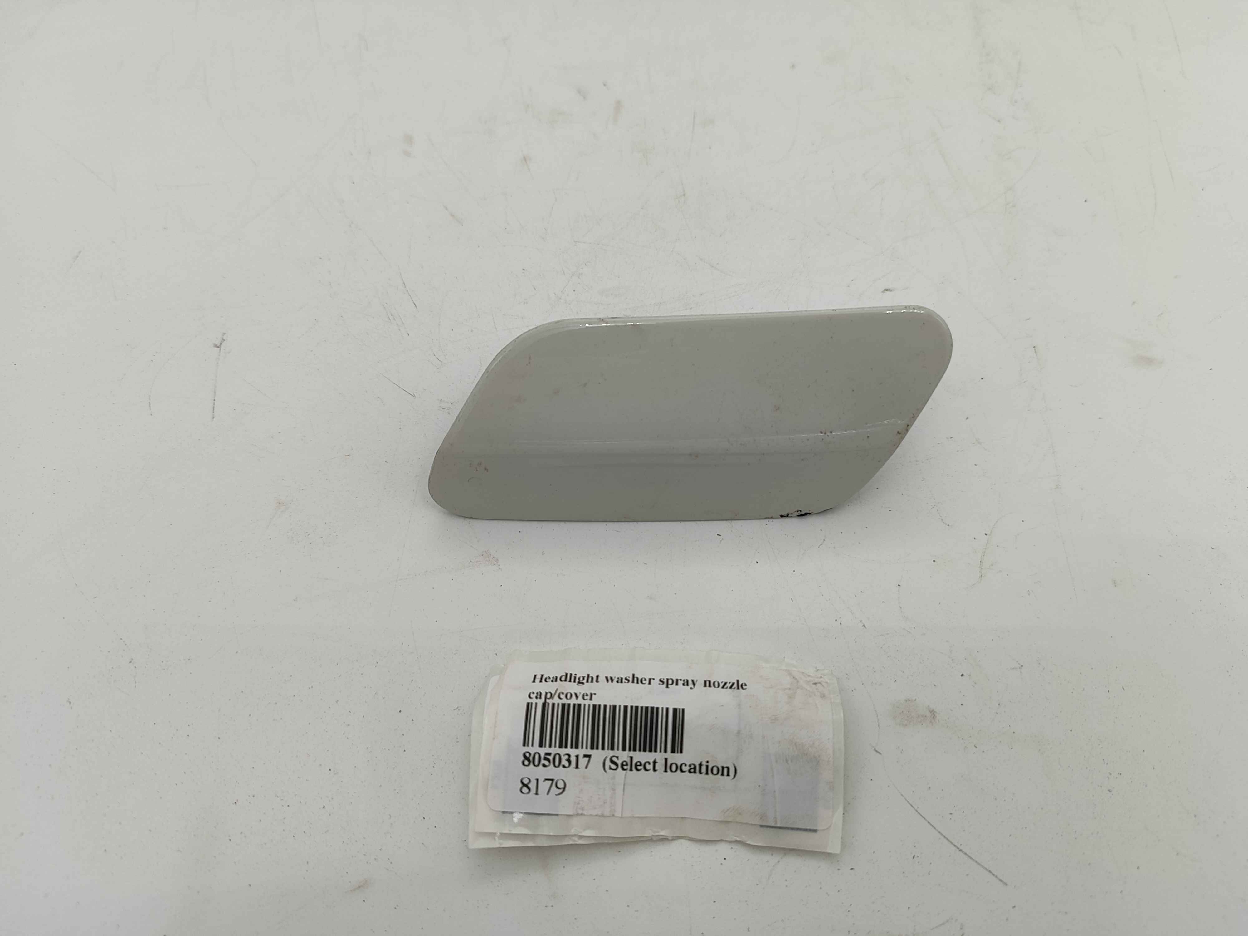 Headlight washer spray nozzle cap/cover