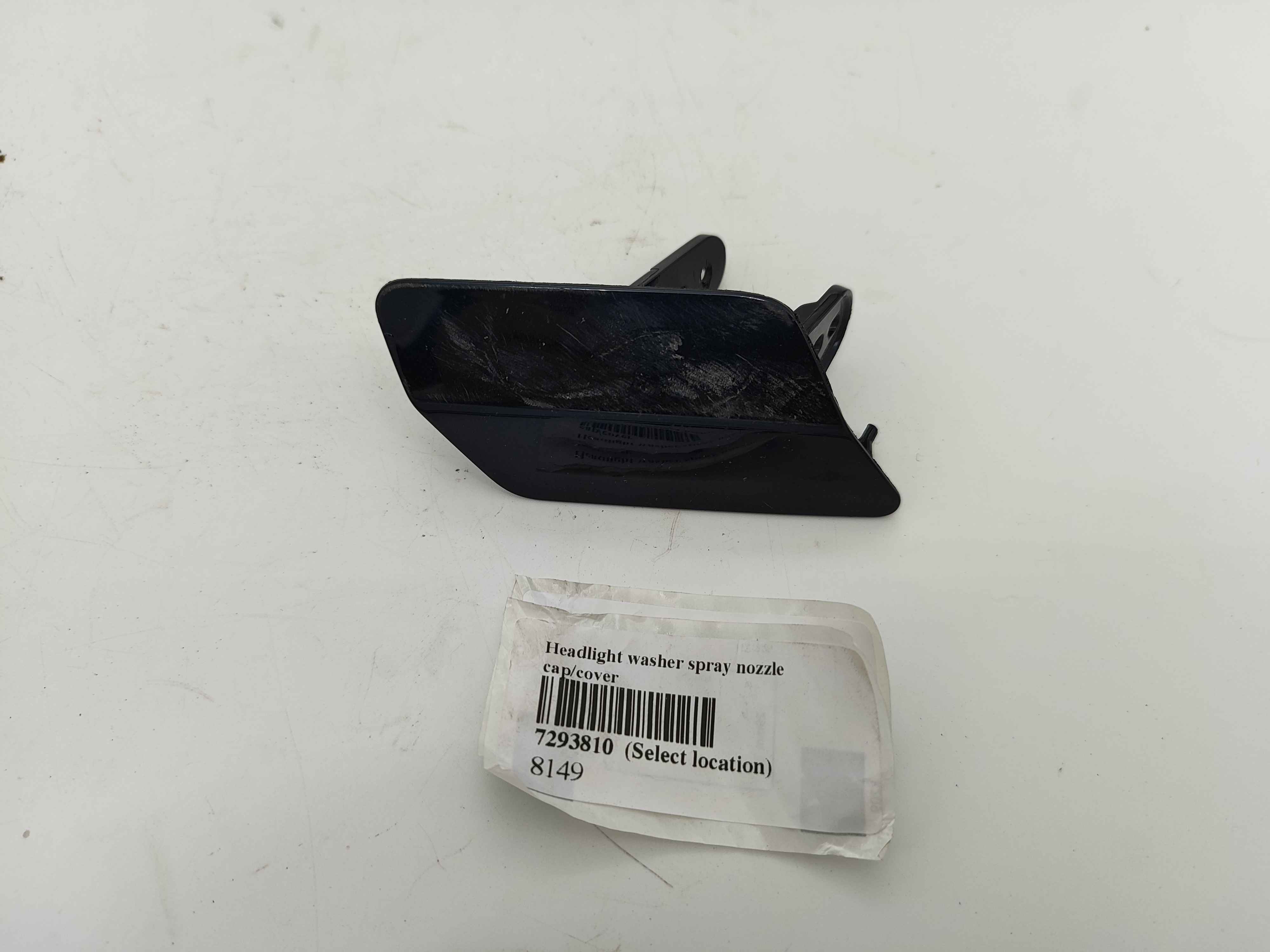 Headlight washer spray nozzle cap/cover